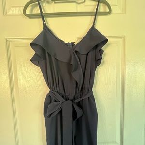 Very cute navy spaghetti strap jumpsuit romper with pockets.